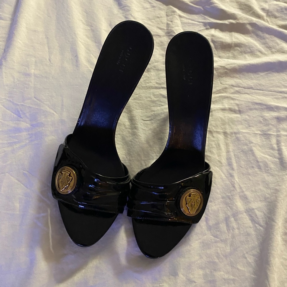 Gucci Black Heeled Slides with Gold Accent